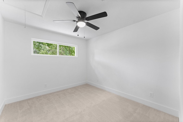 2003 Longstraw Pl, The Woodlands, TX 77380 - unfurnished room featuring attic access, light carpet, baseboards, and a ceiling fan
