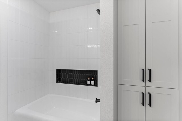 full bathroom with a tub to relax in