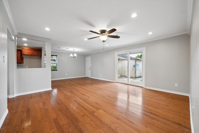 unfurnished room with a ceiling fan, crown molding, recessed lighting, a chandelier, and baseboards