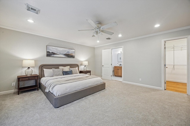 bedroom featuring baseboards, ensuite bath, recessed lighting, carpet, and crown molding