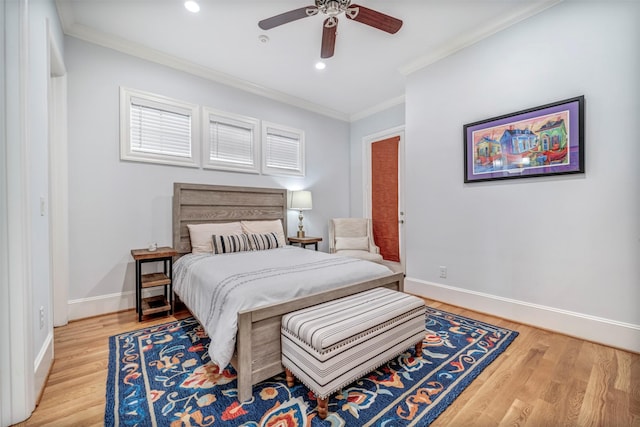 7119 Janet St, Houston, TX 77055 - bedroom with crown molding, light wood-type flooring, baseboards, recessed lighting, and a ceiling fan
