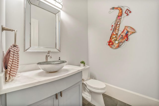 7119 Janet St, Houston, TX 77055 - bathroom featuring vanity, tile patterned floors, and toilet