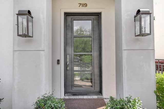 7119 Janet St, Houston, TX 77055 - doorway to property featuring stucco siding