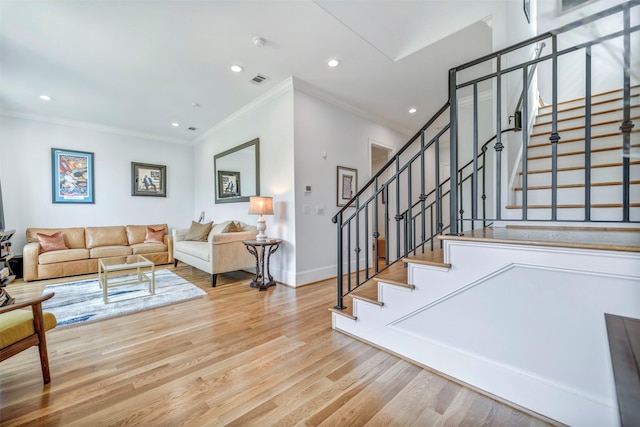 7119 Janet St, Houston, TX 77055 - stairs with ornamental molding, wood finished floors, recessed lighting, and baseboards