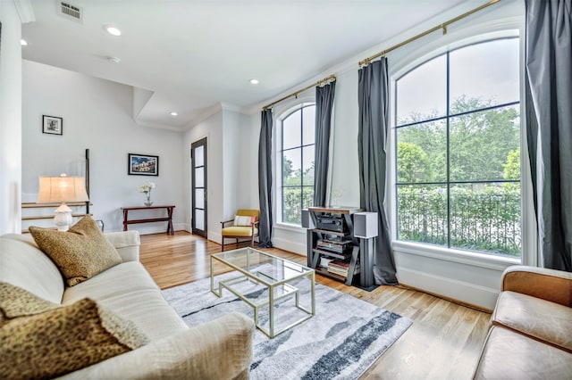 7119 Janet St, Houston, TX 77055 - living area featuring ornamental molding, baseboards, light wood-type flooring, and recessed lighting