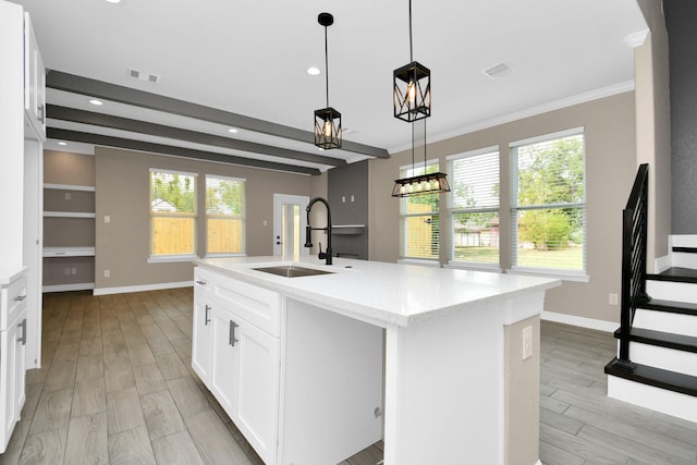 8103 Venus Dr, Houston, TX 77088 - kitchen with a sink, recessed lighting, baseboards, light wood-style floors, and pendant lighting