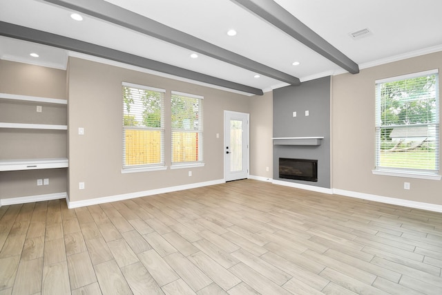 8103 Venus Dr, Houston, TX 77088 - unfurnished living room with beam ceiling, light wood-style flooring, a fireplace, healthy amount of natural light, and crown molding