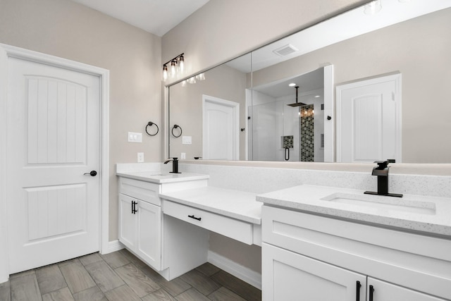 8103 Venus Dr, Houston, TX 77088 - full bathroom featuring a stall shower, double vanity, and baseboards