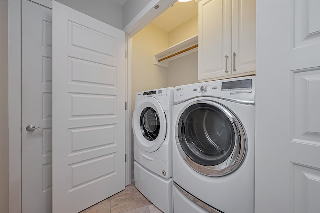 801 E Beach Dr Unit Tw2008, Galveston, TX 77550 - laundry area with independent washer and dryer and cabinet space
