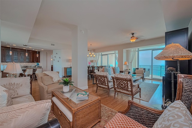 801 E Beach Dr Unit Tw2008, Galveston, TX 77550 - living area featuring wood finished floors, a chandelier, a ceiling fan, and recessed lighting