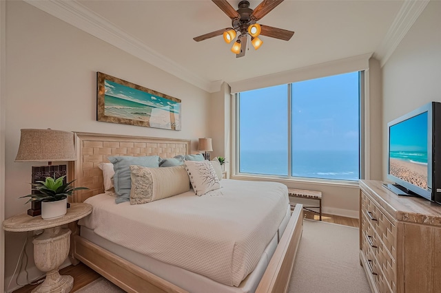 801 E Beach Dr Unit Tw2008, Galveston, TX 77550 - carpeted bedroom featuring crown molding, baseboards, and ceiling fan