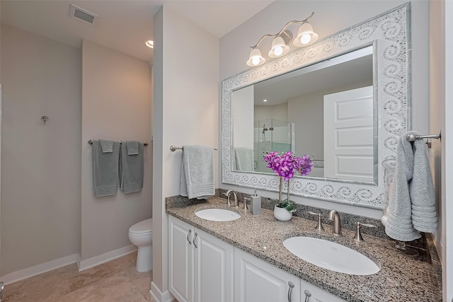 801 E Beach Dr Unit Tw2008, Galveston, TX 77550 - full bathroom featuring a shower stall, double vanity, toilet, and baseboards