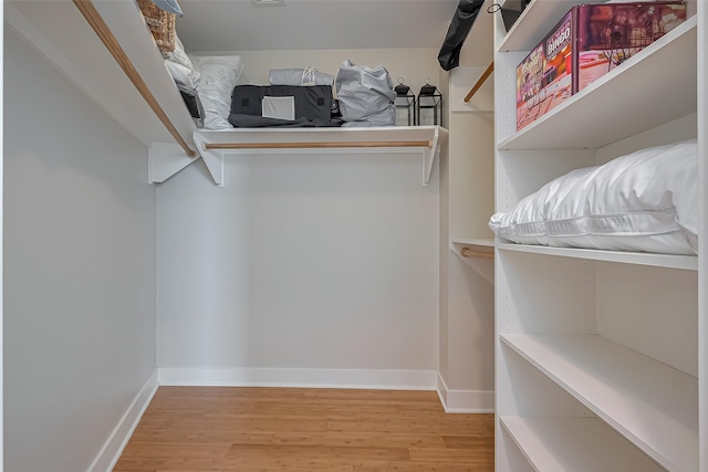 801 E Beach Dr Unit Tw2008, Galveston, TX 77550 - walk in closet with light wood-style floors