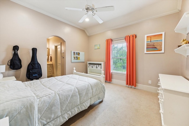 bedroom featuring ornamental molding, arched walkways, light carpet, baseboards, and a ceiling fan