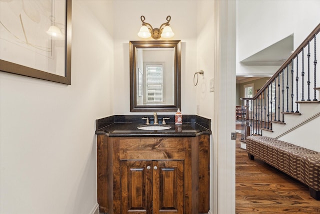 bathroom with wood finished floors and vanity