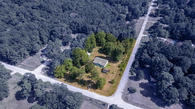 aerial overview of property's location with a forest