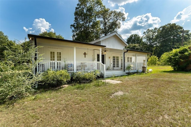 back of house with a lawn, french doors, and covered porch