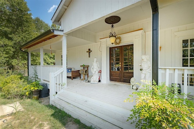 deck with a porch and french doors