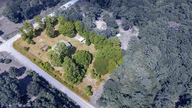 aerial overview of property's location featuring a heavily wooded area