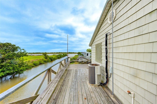 1577 Channel Dr, Brazoria, TX 77422 - wooden deck with central air condition unit and a water view