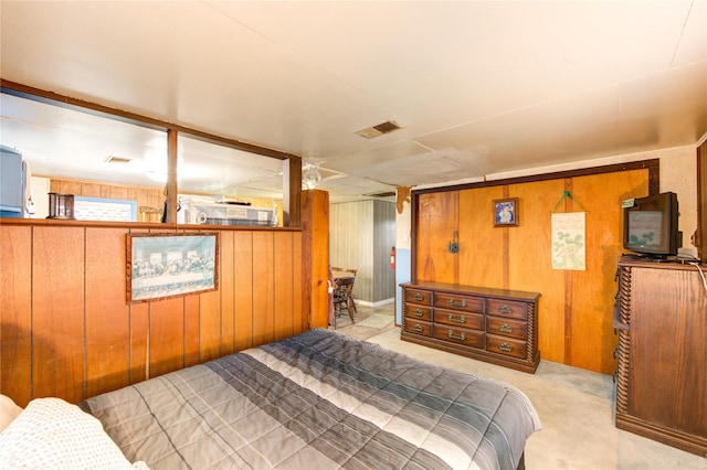 1577 Channel Dr, Brazoria, TX 77422 - carpeted bedroom featuring wood walls