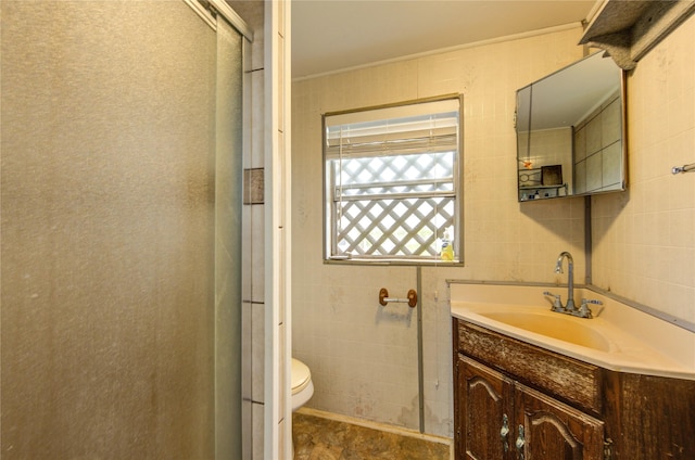 1577 Channel Dr, Brazoria, TX 77422 - bathroom with toilet, a shower stall, vanity, and tile walls