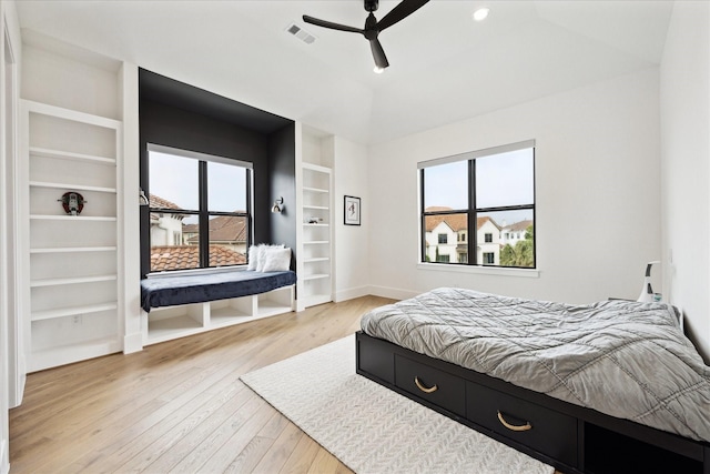 bedroom featuring multiple windows, hardwood / wood-style flooring, baseboards, ceiling fan, and recessed lighting