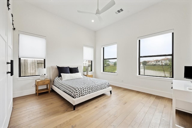 bedroom featuring baseboards, light wood finished floors, recessed lighting, and ceiling fan