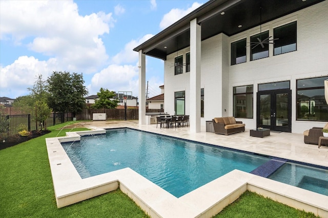 view of swimming pool featuring french doors, a patio, and an outdoor hangout area