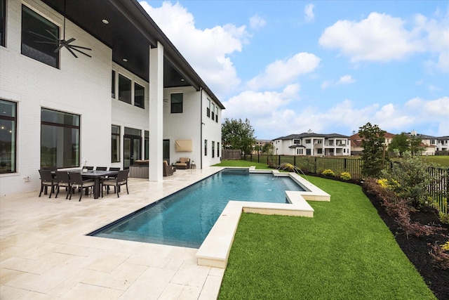 view of swimming pool featuring a ceiling fan, a patio area, and outdoor lounge area