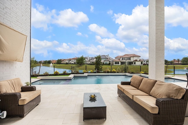 view of swimming pool featuring an outdoor hangout area, a patio area, and a fenced backyard