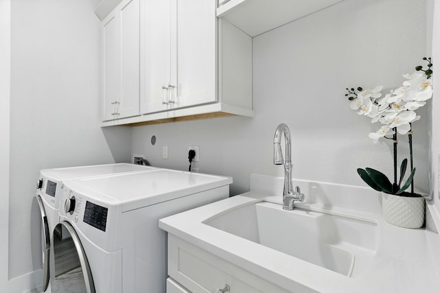 washroom with cabinet space, washing machine and dryer, marble look tiles, and baseboards
