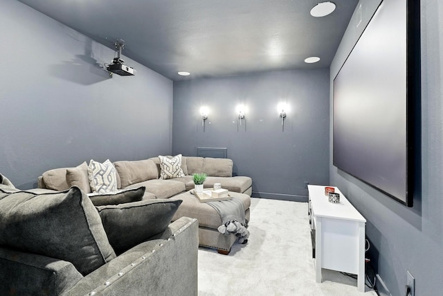 home theater room with light carpet
