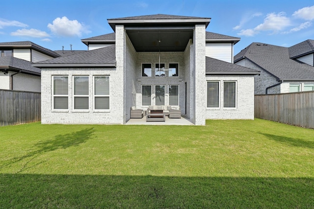rear view of house with an outdoor hangout area, a patio area, a shingled roof, and brick siding