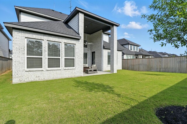 26923 Arethusa Ct, Spring, TX 77389 - back of house with a patio area, brick siding, and a shingled roof