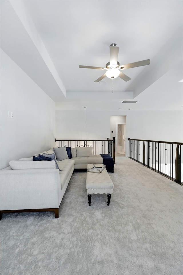 26923 Arethusa Ct, Spring, TX 77389 - living room featuring ceiling fan, carpet floors, and a raised ceiling