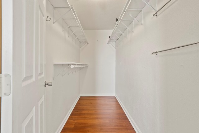 11 Highland Dr, Hitchcock, TX 77563 - walk in closet featuring wood finished floors