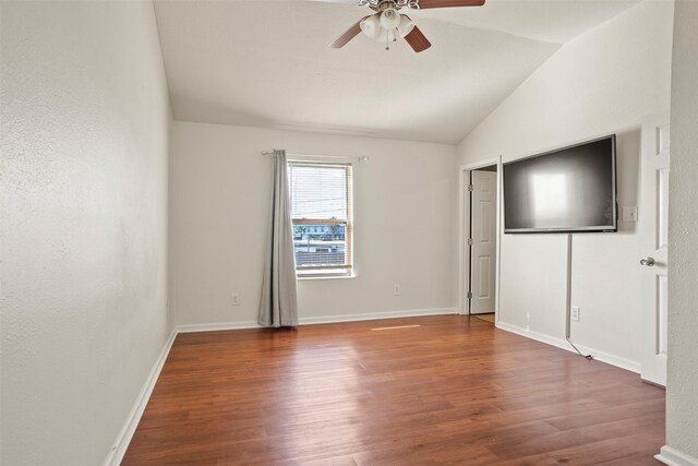 11 Highland Dr, Hitchcock, TX 77563 - unfurnished bedroom with vaulted ceiling, wood finished floors, baseboards, and ceiling fan