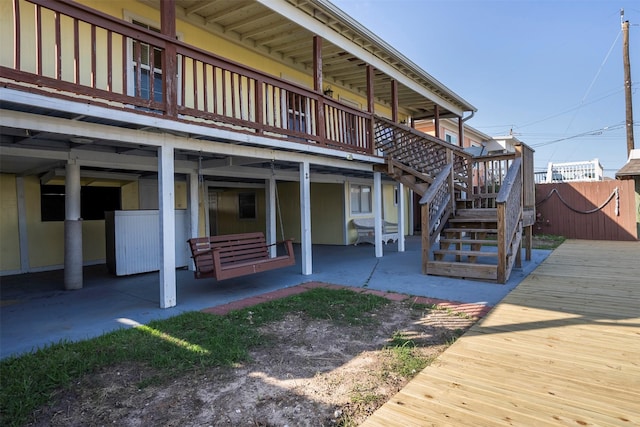 11 Highland Dr, Hitchcock, TX 77563 - back of house featuring stairs, a patio area, and a deck