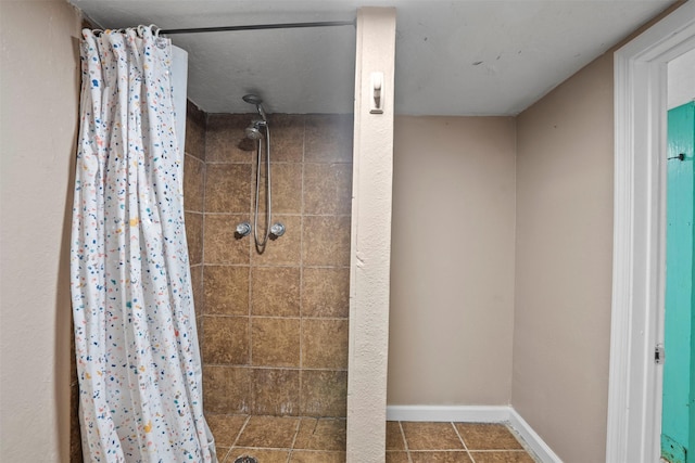 11 Highland Dr, Hitchcock, TX 77563 - full bath featuring tiled shower, baseboards, and tile patterned floors