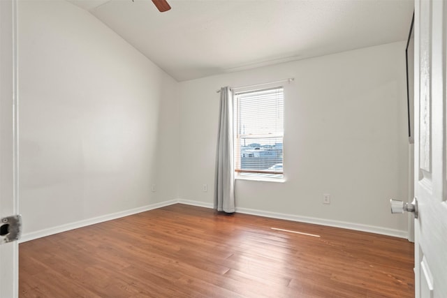 11 Highland Dr, Hitchcock, TX 77563 - spare room featuring vaulted ceiling, wood finished floors, a ceiling fan, and baseboards