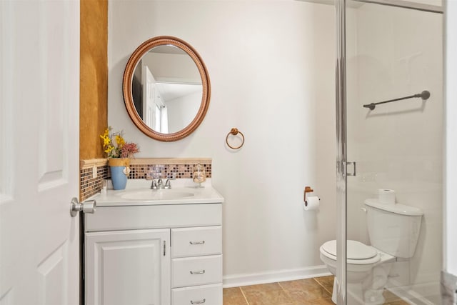 11 Highland Dr, Hitchcock, TX 77563 - bathroom with toilet, decorative backsplash, vanity, tile patterned flooring, and baseboards