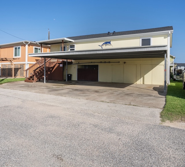 11 Highland Dr, Hitchcock, TX 77563 - garage featuring a carport and concrete driveway