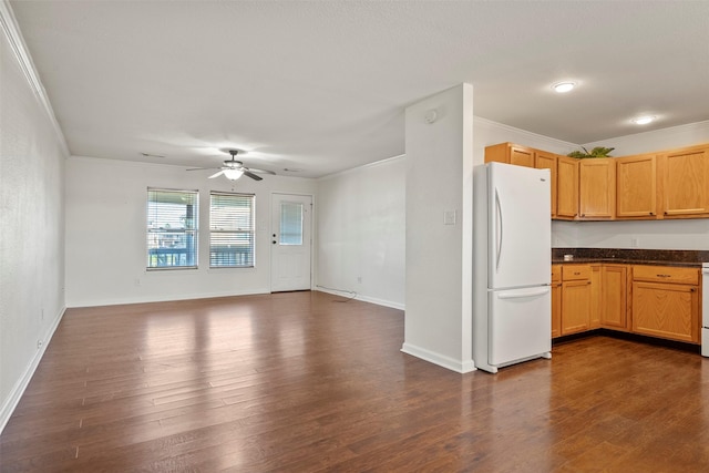 11 Highland Dr, Hitchcock, TX 77563 - kitchen featuring freestanding refrigerator, crown molding, dark wood-type flooring, a ceiling fan, and baseboards