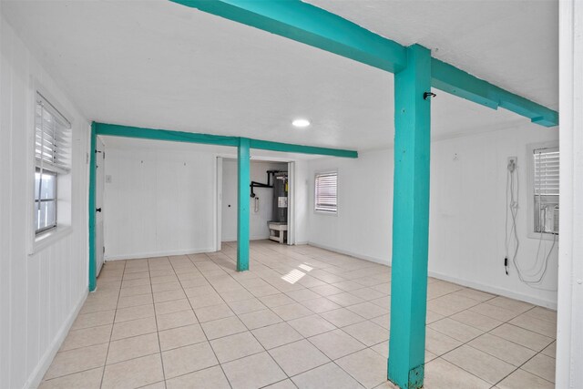11 Highland Dr, Hitchcock, TX 77563 - basement with light tile patterned floors, water heater, baseboards, and recessed lighting