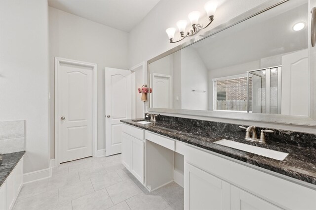 full bath featuring tile patterned flooring and double vanity