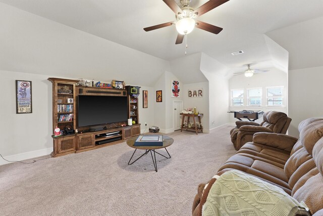 living area featuring a ceiling fan, light carpet, baseboards, and lofted ceiling