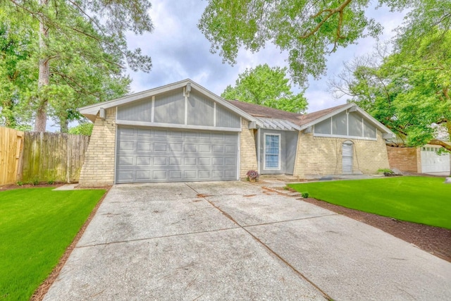 24011 Lone Elm Dr, Spring, TX 77373 - view of front of home with brick siding, an attached garage, and concrete driveway