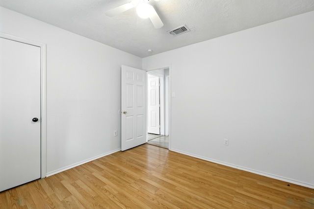 24011 Lone Elm Dr, Spring, TX 77373 - unfurnished bedroom with light wood-type flooring, baseboards, and ceiling fan