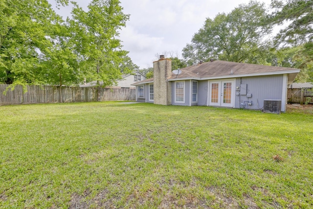 24011 Lone Elm Dr, Spring, TX 77373 - view of yard with french doors and cooling unit